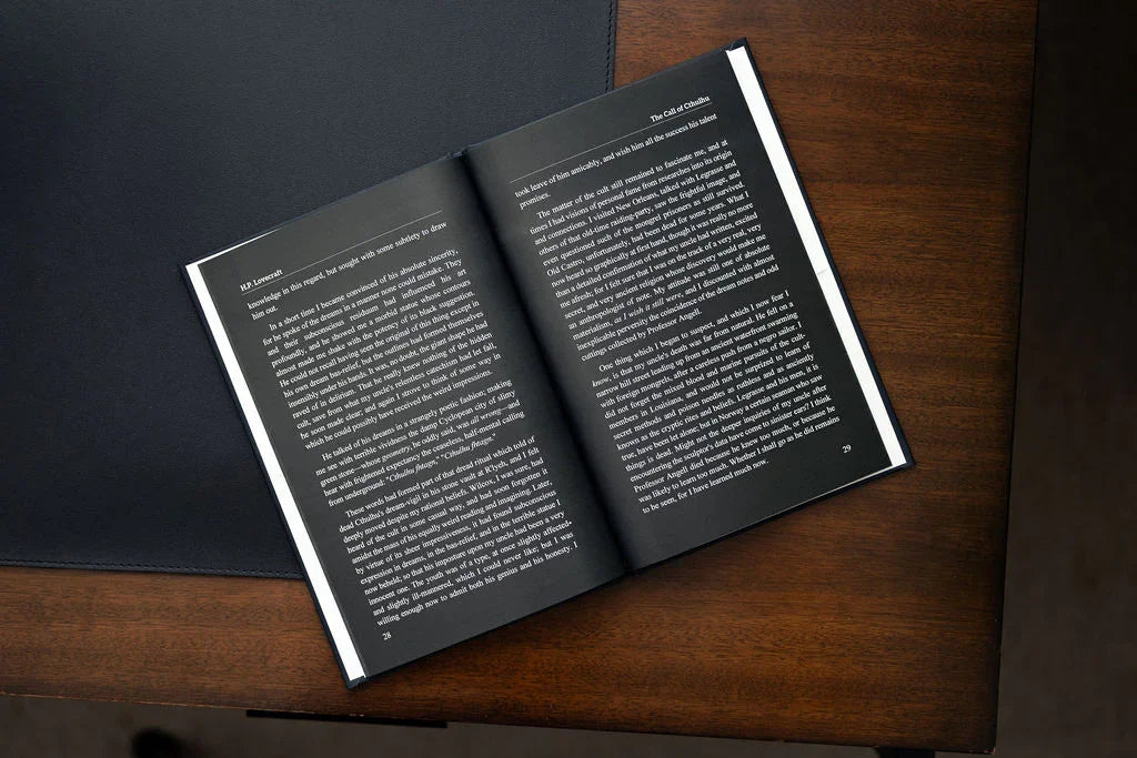 Open book with text on a wooden surface