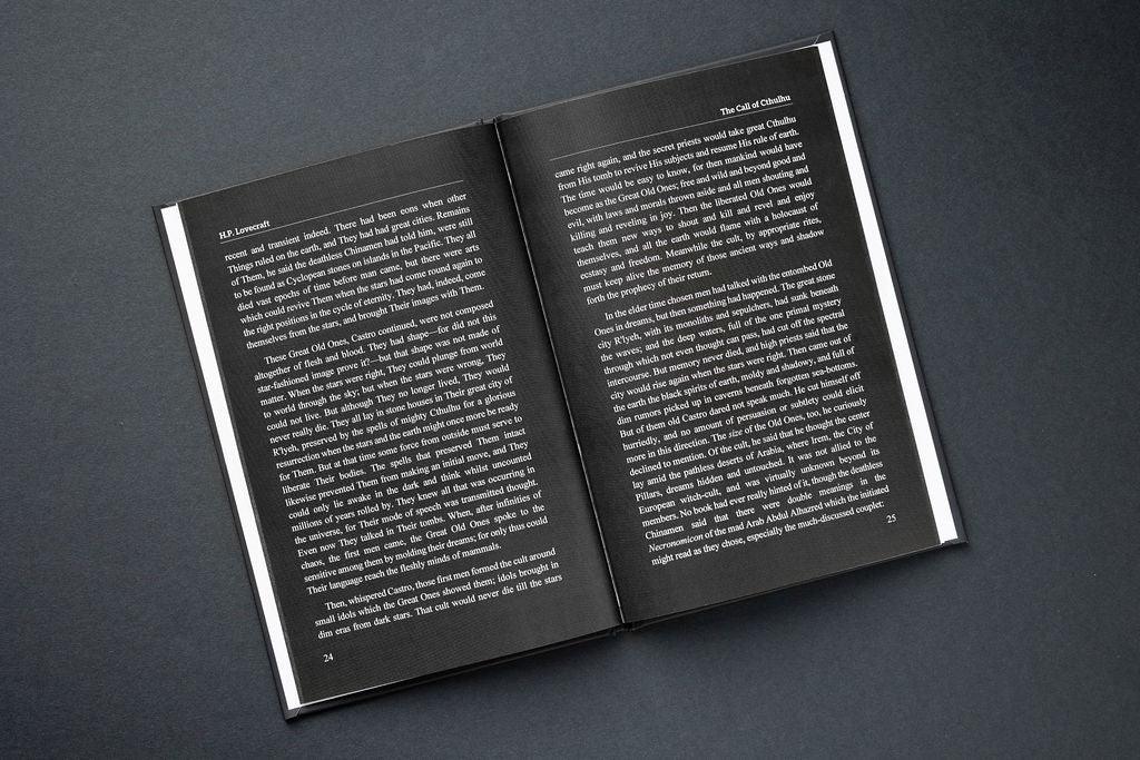 Open book with text on a dark gray background