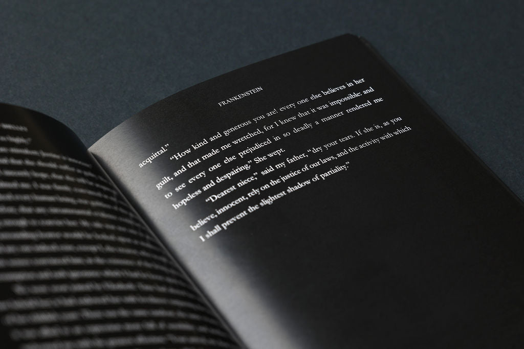 Open book with text on a dark background