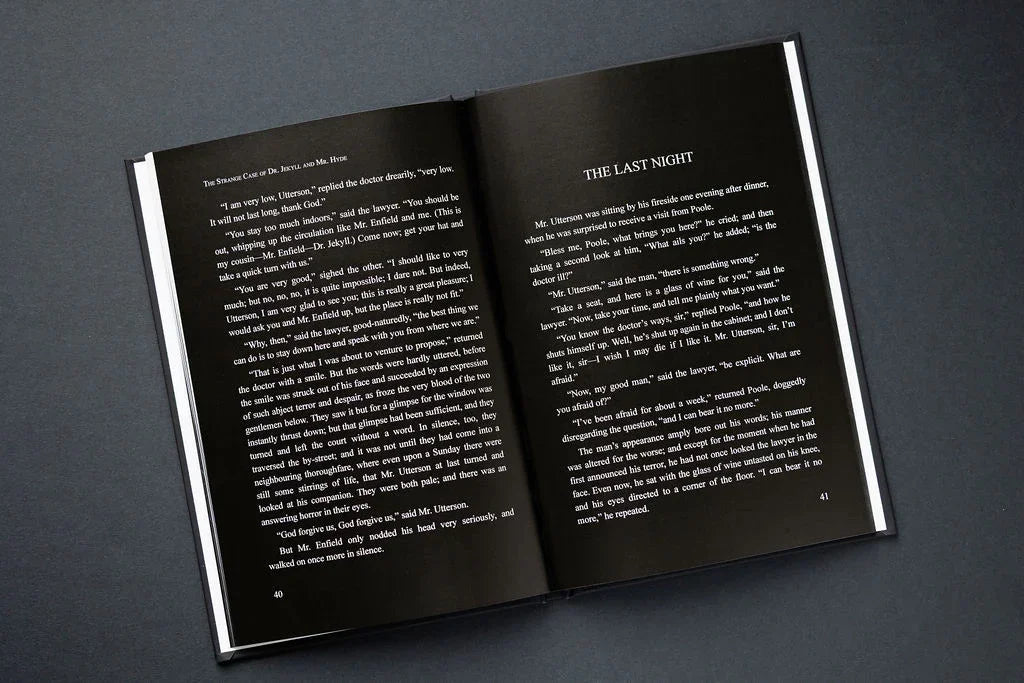 Open book with text on a dark gray background