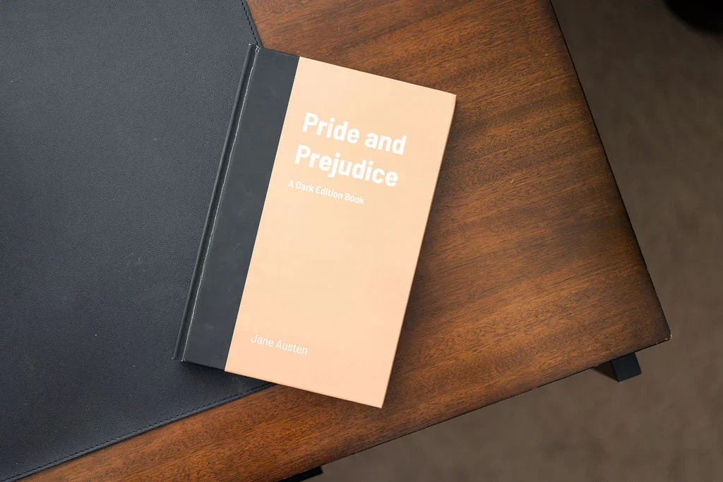 Book titled 'Pride and Prejudice' on a wooden surface with a blurred background
