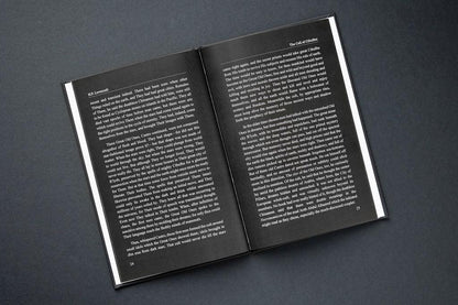 Open book with text on a dark gray background