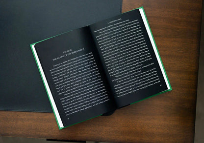 Open book on a wooden surface with text visible