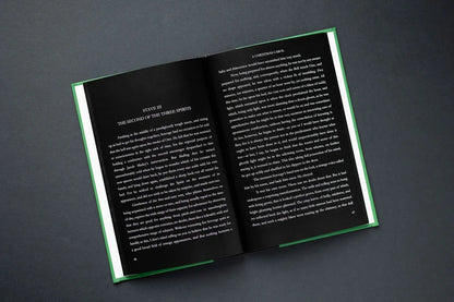Open book with text on a dark gray background