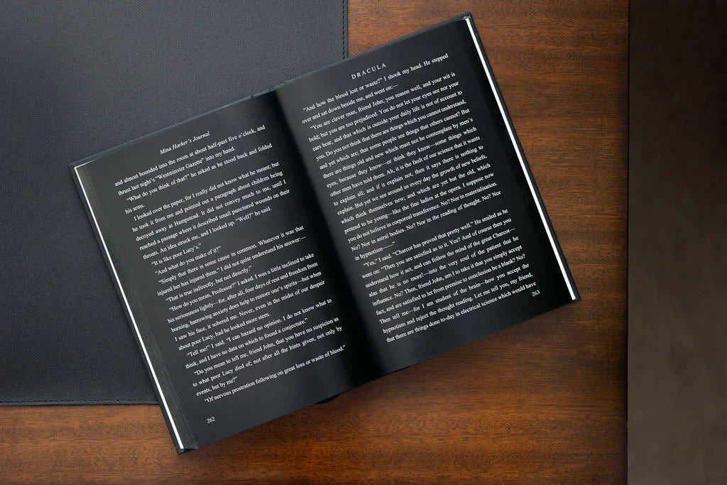 Open book with text on a wooden surface