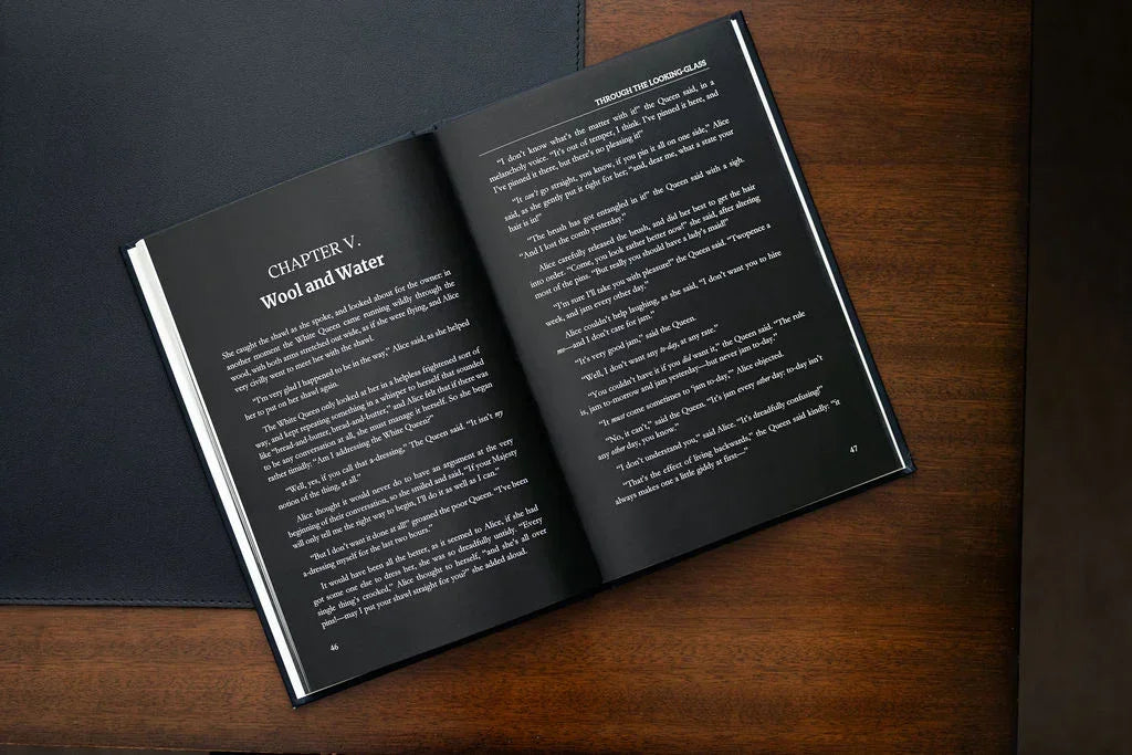 Open book on a wooden surface with text visible