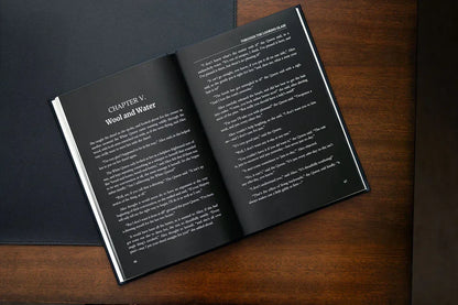 Open book on a wooden surface with text visible