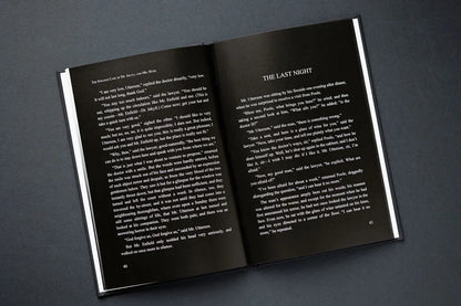 Open book with text on a dark gray background