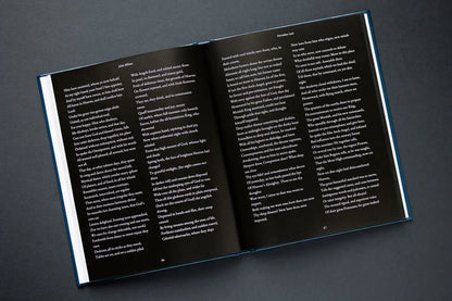 Open book with text on a dark gray background