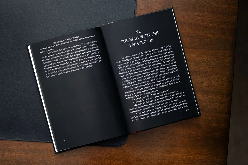 Open book on a wooden surface with text visible