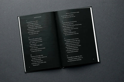 Open book with text on a dark gray background